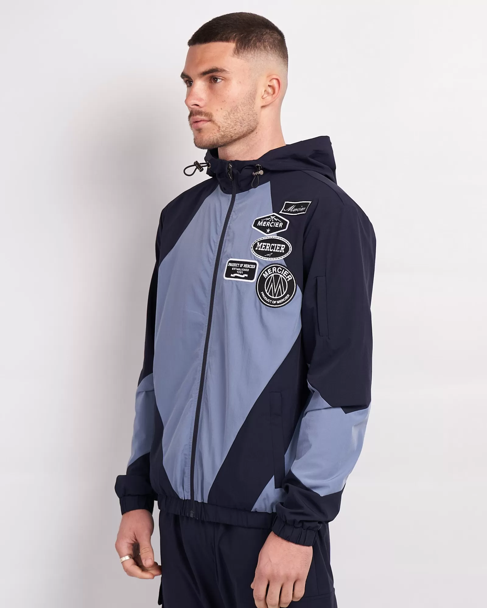 Windjacken & Cargohosen>Mercier Navy Placid Blue Mono Abzeichen Getäfelte Wind jacke